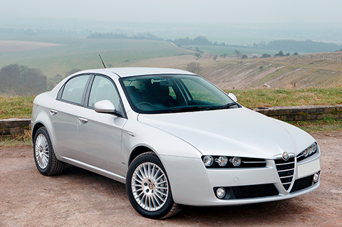 White Alfa Romeo parking on the countryside, dusty background