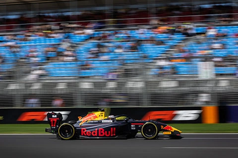 Formula 3 race car in action in front of the crowd