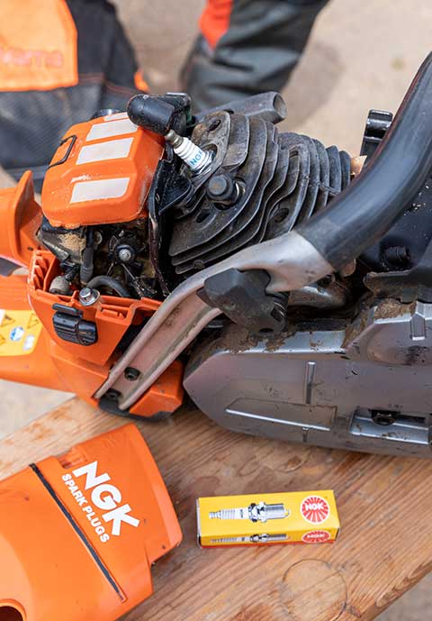 Chainsaw with NGK spark plugs 